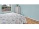 Calming bedroom features a queen bed and a white dresser with a large window at 904 Addington Ct # 204, Venice, FL 34293