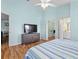 Bedroom with view to other rooms, ensuite bathroom, and large dresser at 904 Addington Ct # 204, Venice, FL 34293