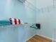 Walk-in closet with shelving and teal and white towels at 904 Addington Ct # 204, Venice, FL 34293