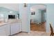 Kitchen view showcasing the dishwasher and the doorway leading to the dining area at 904 Addington Ct # 204, Venice, FL 34293