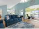 Open-concept living area with a comfortable sofa, bar seating, and access to other living spaces at 904 Addington Ct # 204, Venice, FL 34293