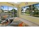 Bright sunroom filled with natural light featuring large windows and cozy seating area at 904 Addington Ct # 204, Venice, FL 34293