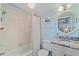 Bathroom featuring a shower with white curtain, a toilet, and a vanity with granite countertop at 950 Tarpon Center Dr # 504, Venice, FL 34285