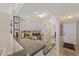 Bright kitchen with black countertop and a view of dining room and entry door at 950 Tarpon Center Dr # 504, Venice, FL 34285