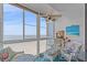 Enclosed lanai with seating area and expansive views of the white sand beach at 950 Tarpon Center Dr # 504, Venice, FL 34285