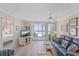 A comfortable living room with ocean views and a peek into the Primary bedroom at 950 Tarpon Center Dr # 504, Venice, FL 34285