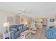 Comfortable living room with a view of the kitchen and dining area at 950 Tarpon Center Dr # 504, Venice, FL 34285