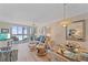 Relaxing living room with waterfront views, comfortable furniture, and a dining area at 950 Tarpon Center Dr # 504, Venice, FL 34285