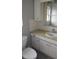 Bathroom featuring single sink vanity with cabinet and toilet at 1001 Sandlewood Dr, Venice, FL 34293
