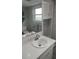 Bathroom featuring single sink vanity with mirror and cabinet for storage at 1001 Sandlewood Dr, Venice, FL 34293