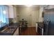 Modern kitchen with stainless steel appliances, dark countertops, and a stylish backsplash at 1001 Sandlewood Dr, Venice, FL 34293