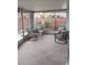 Screened porch featuring patio furniture with view of backyard at 1001 Sandlewood Dr, Venice, FL 34293
