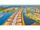 Aerial view of a large residential community surrounded by water and golf courses at 10808 Tarflower Dr # 102, Venice, FL 34293