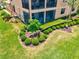 Beautifully landscaped backyard with manicured bushes and lush green lawn, perfect for outdoor relaxation at 10808 Tarflower Dr # 102, Venice, FL 34293