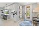 Foyer features decorative door, tile flooring, and open views of the kitchen at 10808 Tarflower Dr # 102, Venice, FL 34293