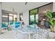 Relaxing outdoor lanai with stylish furniture and a stunning view of the lake at 10808 Tarflower Dr # 102, Venice, FL 34293