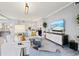 Living room showcasing comfortable seating, stylish decor, and modern entertainment center at 10808 Tarflower Dr # 102, Venice, FL 34293