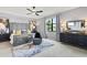 Modern main bedroom featuring stylish furniture, ceiling fan, and window view at 10808 Tarflower Dr # 102, Venice, FL 34293