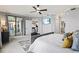 Spacious main bedroom with ceiling fan, sliding glass doors to lanai, and access to the kitchen at 10808 Tarflower Dr # 102, Venice, FL 34293