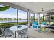 The spacious screened-in patio offers a comfortable seating area with scenic views at 10808 Tarflower Dr # 102, Venice, FL 34293