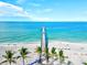 Panoramic aerial view of Venice Pier on a sunny day, showcasing the pristine beach and clear blue ocean at 10808 Tarflower Dr # 102, Venice, FL 34293