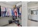 Walk-in closet with wire rack shelving and organization system, connects to main bathroom at 10808 Tarflower Dr # 102, Venice, FL 34293