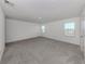 Comfortable bedroom with neutral carpet and multiple windows at 11228 Fieldstone Dr, Palmetto, FL 34221