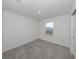 Bedroom featuring neutral carpet and one window offering natural light and a view of the neighborhood at 11228 Fieldstone Dr, Palmetto, FL 34221