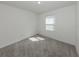 Bedroom featuring neutral carpet and one window offering natural light at 11228 Fieldstone Dr, Palmetto, FL 34221