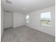 Bright bonus room features neutral carpet and an abundance of natural light from two large windows at 11228 Fieldstone Dr, Palmetto, FL 34221