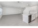 Bright, open living space with tile flooring and a kitchen island at 11228 Fieldstone Dr, Palmetto, FL 34221