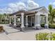 Pool house and grill with a shaded picnic area, perfect for outdoor entertaining at 11228 Fieldstone Dr, Palmetto, FL 34221