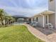 Lush backyard featuring a screened pool area and well-maintained landscaping at 1234 Paradise Way, Venice, FL 34285