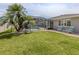 Landscaped backyard with a large pool and outdoor patio area, ideal for entertaining at 1234 Paradise Way, Venice, FL 34285