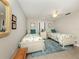 Cozy bedroom featuring twin beds, ceiling fan, and tropical-themed decor at 1234 Paradise Way, Venice, FL 34285