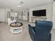 Inviting living room with tile flooring and a stylish entertainment center perfect for relaxation and enjoyment at 1234 Paradise Way, Venice, FL 34285