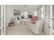 Inviting living room with coastal decor, comfortable seating, and tile flooring at 1234 Paradise Way, Venice, FL 34285