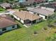 Aerial view of a home with screened-in lanai and tile roof at 12728 Richezza Dr, Venice, FL 34293