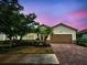 Charming single-story home with a two-car garage and well-maintained landscaping at 12728 Richezza Dr, Venice, FL 34293