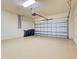 Clean two-car garage with epoxy floor and ample storage space at 12728 Richezza Dr, Venice, FL 34293