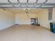 Spacious two-car garage features an epoxy floor and utility sink at 12728 Richezza Dr, Venice, FL 34293