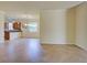 Open floorplan featuring a living room that flows into the kitchen with tile floors at 12728 Richezza Dr, Venice, FL 34293
