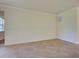 Living room featuring neutral walls, white trim, and tile flooring throughout at 12728 Richezza Dr, Venice, FL 34293