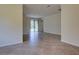 Bright living room with tile floors and sliding glass doors leading to the outside at 12728 Richezza Dr, Venice, FL 34293