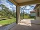 A screened-in patio offers seamless indoor-outdoor living with tranquil backyard views at 12728 Richezza Dr, Venice, FL 34293