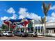 Inviting town center with colorful canopies, shops, and ample parking, perfect for leisure and shopping at 12728 Richezza Dr, Venice, FL 34293