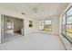 Bright sun room with large windows offering natural light and sliding door access at 1316 Ridgewood Ave, Venice, FL 34285