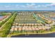 Aerial view of the community showcasing beautiful lake views, lush landscaping, and residential layout at 13873 Karina St, Venice, FL 34293