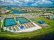 Aerial view of community amenities including pickleball courts, garden plots, and green spaces at 13873 Karina St, Venice, FL 34293