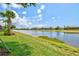 Picturesque water view from the backyard, highlighting the peaceful setting and natural beauty of the property at 13873 Karina St, Venice, FL 34293